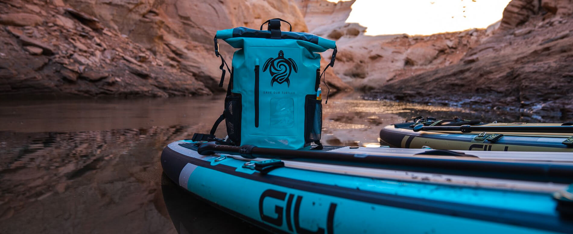 GILI waterproof backpack on deck of an inflatable paddle board